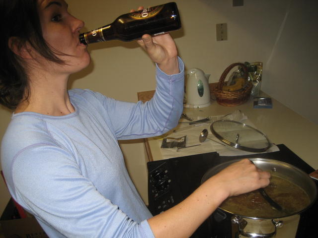 kt sucks one down while stirring the wort