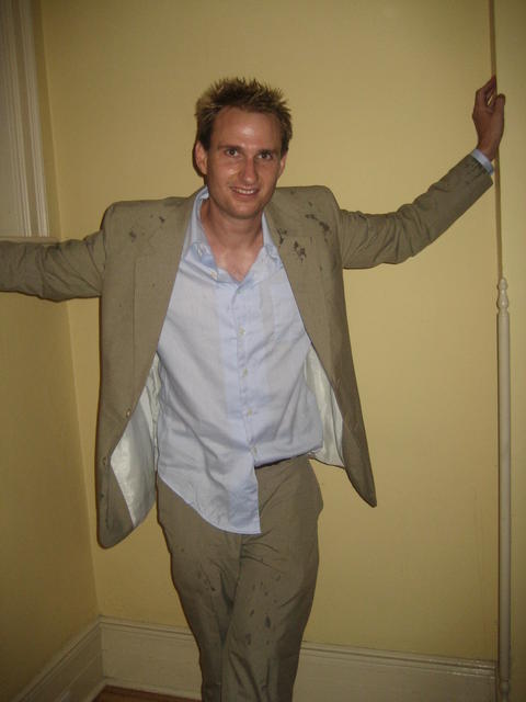 trousers ripped, redbull on jacket...